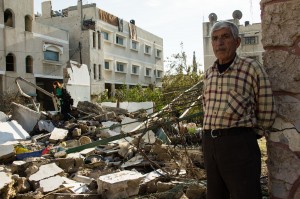 Ahmed Suleman Ateya standing next to his destroyed home in Gaza - Photo: Johnny Barber, November 29th, 2012