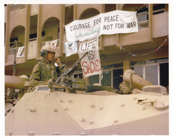 U.S. Marines occupy Baghdad, in March 2003, in front of the Al Fanar hotel that housed Voices activists throughout the Shock and Awe bombing. 