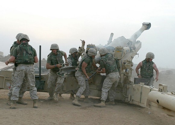 U.S. Marines fire a Howitzer in Fallujah, Iraq 2004.