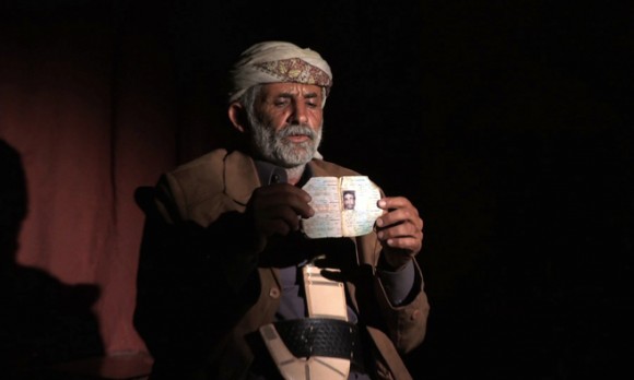Abdullah Muhammad al-Tisi holds a photo of his son, who was killed in a US drone strike in December. Credit: Human Rights Watch
